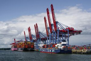 Cargo ships docked at Hamburg port, showcasing global shipping activity and logistics.